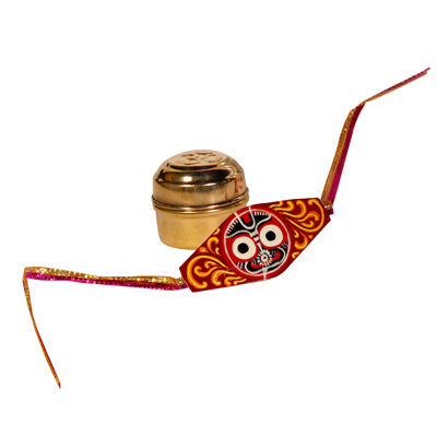 Our premium handcrafted Jagannath rakhi, complete with roli and chawal in a brass tin