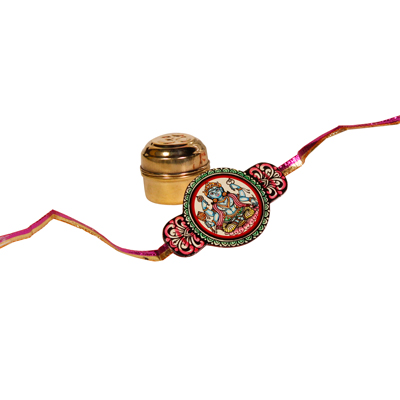 Handcrafted rakhi with Pattachitra art, roli chawal in brass tin